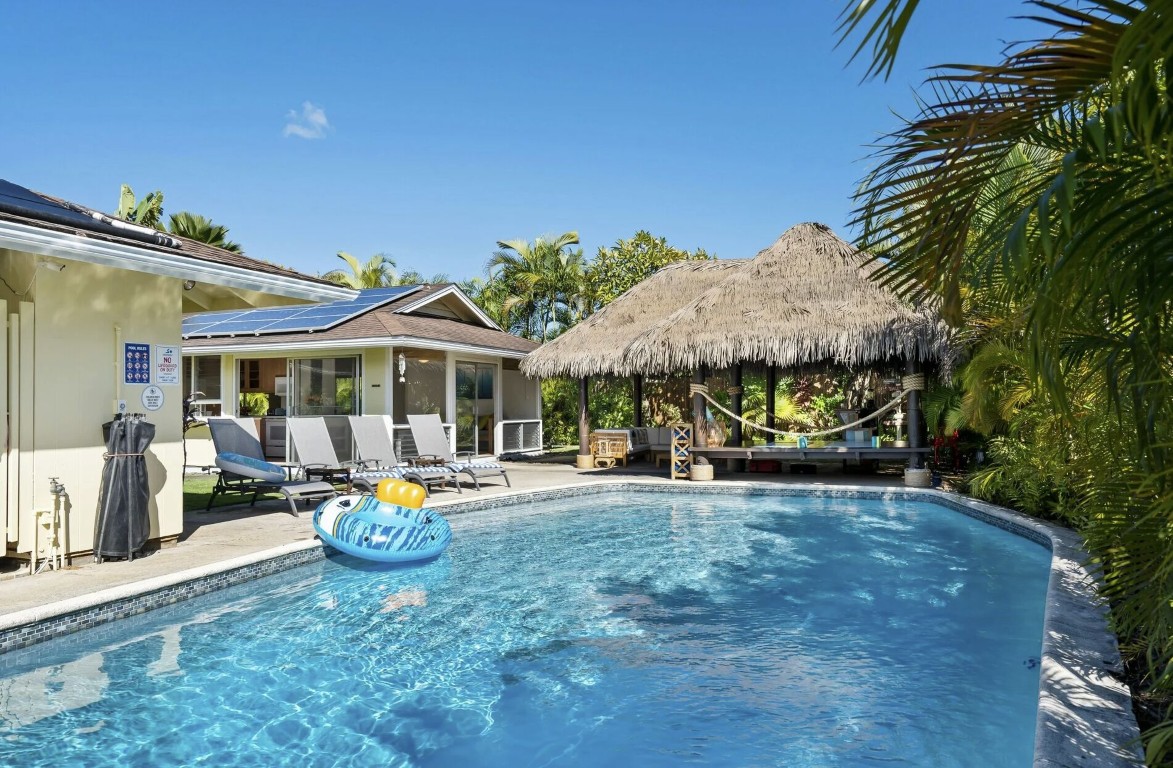 Professional pool technician servicing pool in Vacaville, CA